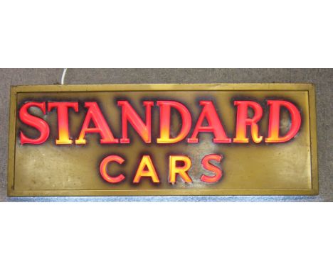 Three 'Standard Cars' signs,one light box with moulded lettering 93 x 32 x 20cm, wired for illumination: a display card dated