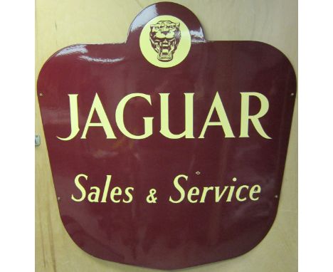 A Jaguar Sales and Service vitreous enamelled sign,single-sided cut-out shield shape, in generally good condition (with three