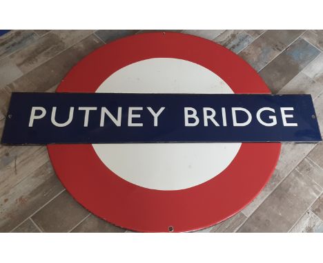 Putney Bridge, a  London Underground 56 inch enamel sign,the iconic roundel design, in red, white and blue, made up of three 