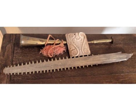 Vintage tile, hunting horn and saw fish head.