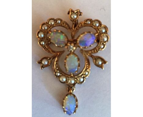 Nine carat gold, opal and seed pearl pendant/brooch.