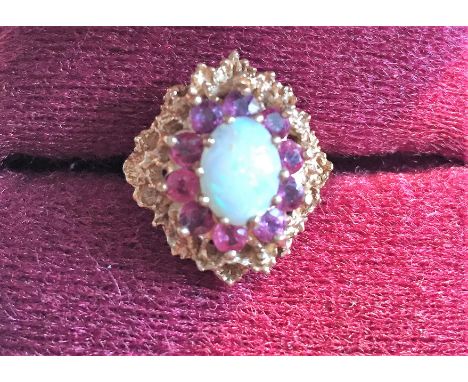 A 9ct gold opal and garnet dress ring size L