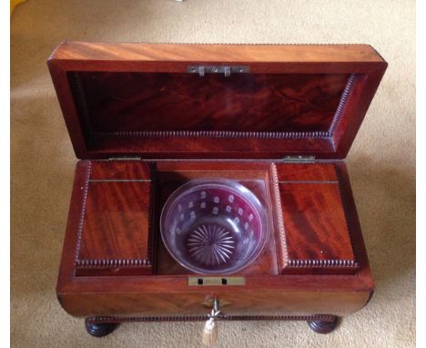 Superb quality Regency flame mahogany tea caddy of sarcophagus form