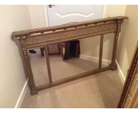 Regency gilt wood and gesso three panel overmantle mirror