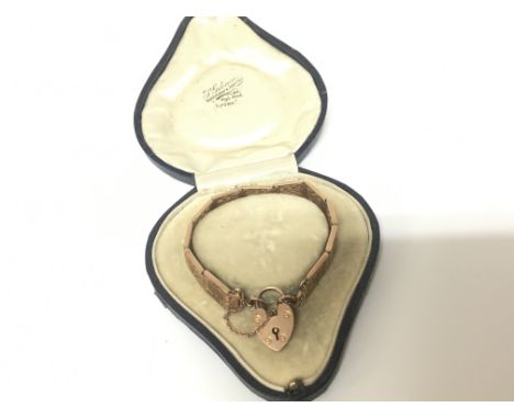 A Quality Rose Gold 9carat gate bracelet with a padlock clasp in a fitted box weight 21g