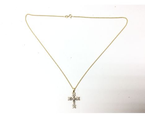 A gold 18ct diamond cross and 9ct gold chain. Overall weight of 5.2g Postage category A
