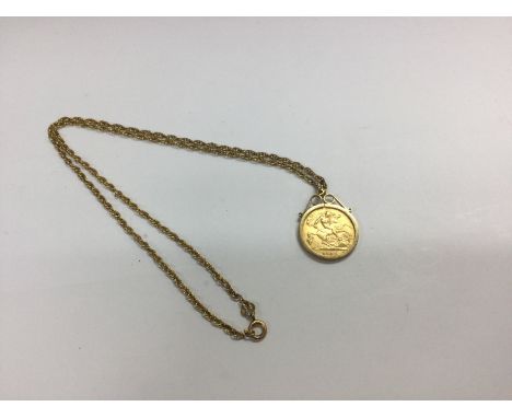 A 1915 half sovereign in a pendant mount with a chain. Approx 9.39 grams.