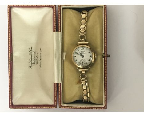 A Vintage ladies 9carat gold watch with attached Roll gold strap in fitted box.
