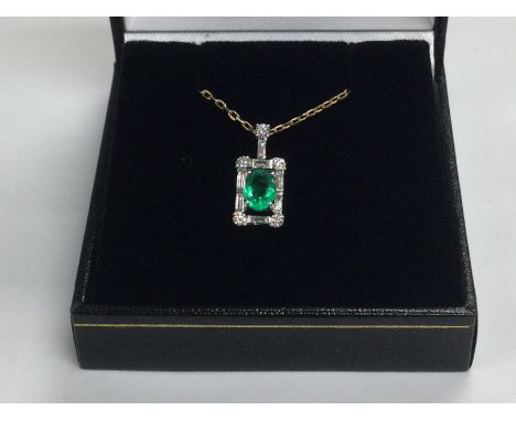 A certificated stylish 18ct white gold oval cut emerald and diamond pendant on an 18ct rose gold chain. Emerald approx 0.58ct