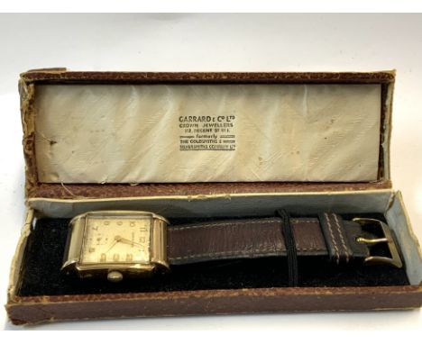 A gents 9ct gold cased Garrard wrist watch with the original presentation box, inscribed to reverse 25 Years service, Vauxhal