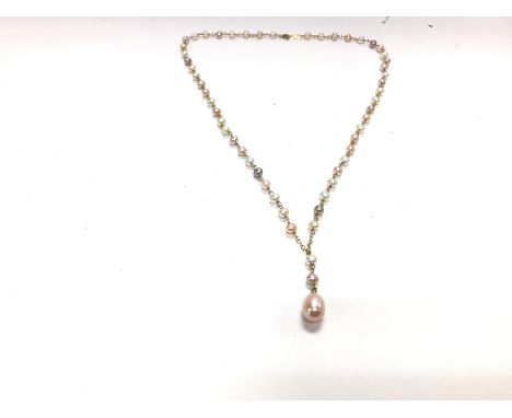 A cultured string of pearls on a 10ct chain. 43cm. Postage A- NO RESERVE