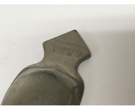 A Liberty & Co English Pewter Arts and Crafts Caddy Spoon. With detailed marks and serial number.