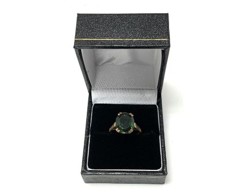 A 9ct gold ring set with a green polished hardstone. K, 3.2g (A)- NO RESERVE