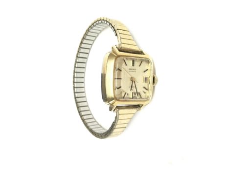 A vintage Seiko automatic wrist watch on a stretch bracelet. Winds and runs. With box. Postage B