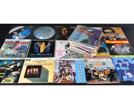 A mixed collection of approx; 55 45rpm vinyl singles of varying artists to include multiple examples from The Beatles with ma