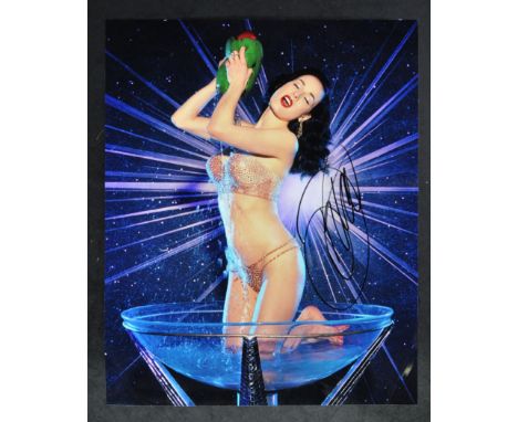Dita Von Teese - Burlesque Dancer - autographed 11x14" colour photograph of Von Teese. Signed neatly in black ink to a light 