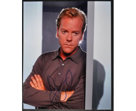 Kiefer Sutherland - 24 (American Television Series) - autographed 8x10" colour photograph, signed in blue ink to a lighter ce