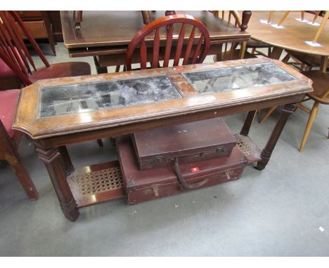 Two vintage leather suitcases and a modern side table 