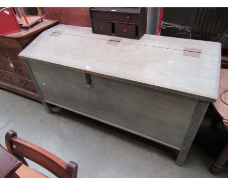 A distressed painted pine large storage trunk with iron latch and hinges