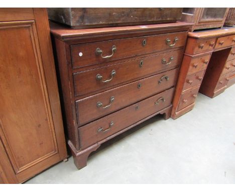 A George III oak chest of four graduating drawers on bracket feet 