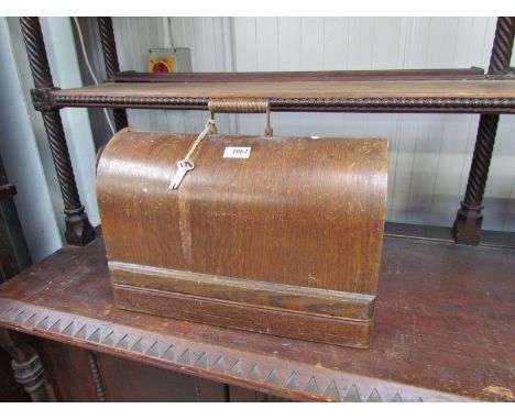 A cased vintage sewing machine 