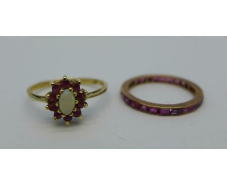 A 9ct gold, opal and ruby ring, 1.6g, O, and a yellow metal and ruby eternity ring, 1.3g, L