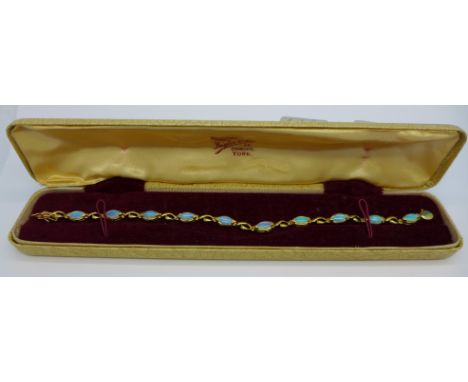 A 9ct gold and opal bracelet, 5.5g