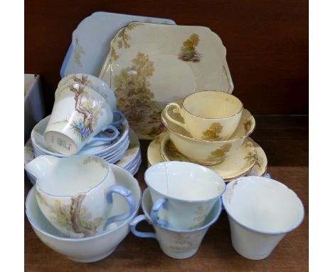 Two Shelley part tea sets, blue service lacking one cup, one cup cracked