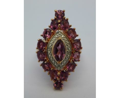 A silver gilt, rhodolite garnet ring, M