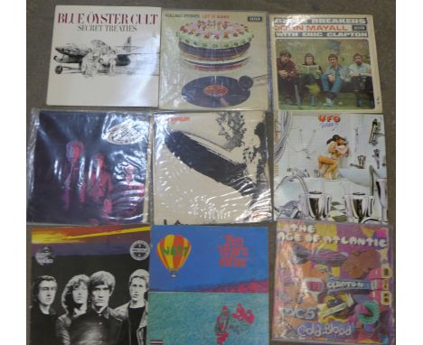 A collection of thirteen LP records including Blue Oyster Cult, Rolling Stones, Toy Dolls, etc.