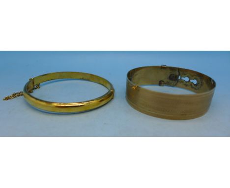 A rolled gold bangle and a 9ct gold and silver bangle