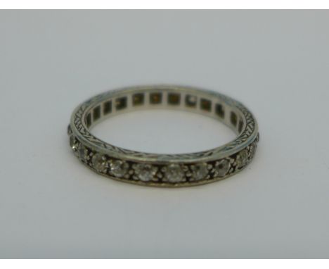 A white metal and diamond set eternity ring, 3.5g, M