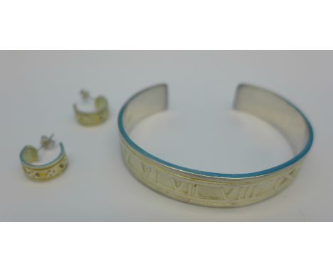 A silver Tiffany bangle and a pair of 925 silver earrings