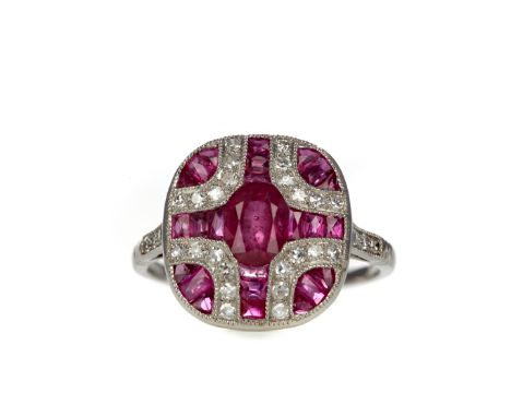 RUBY, SPINEL AND DIAMOND RING, set with an oval ruby, calibre cut rubies and spinels and round brilliant cut diamonds, on dia