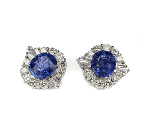 PAIR OF SAPPHIRE AND DIAMOND EARRINGS, set with oval sapphires totalling approximately 4.82 carats, within a halo of round br