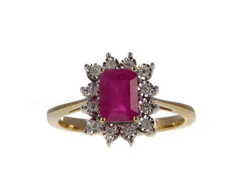 RUBY AND DIAMOND RING set with an octagonal step cut ruby of approximately 1.44 carats, within an illusion set diamond halo t