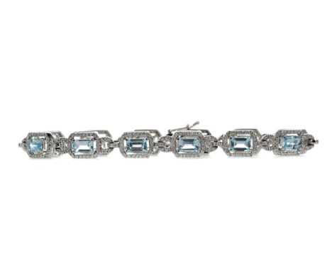 TOPAZ AND DIAMOND BRACELET, set with step cut blue topaz stones totalling approximately 9.20 carats, each within a round bril