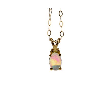 OPAL PENDANT, set with an oval Ethiopian opal beneath two diamond chips, marked 10K, on a chain marked 375, 0.7g