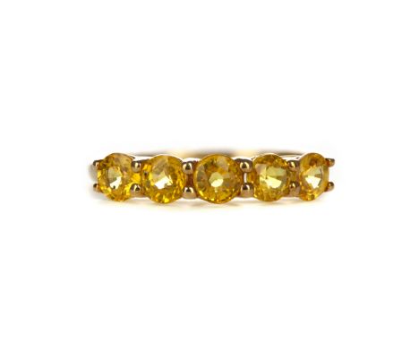 TREATED YELLOW SAPPHIRE RING, set with treated round yellow sapphires, marked 9K, size P, 1.8g