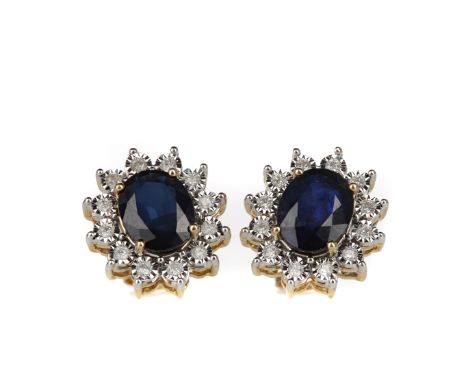 PAIR OF SAPPHIRE AND DIAMOND EARRINGS, set with oval sapphires totalling approximately 3.85 carats, within a halo of illusion