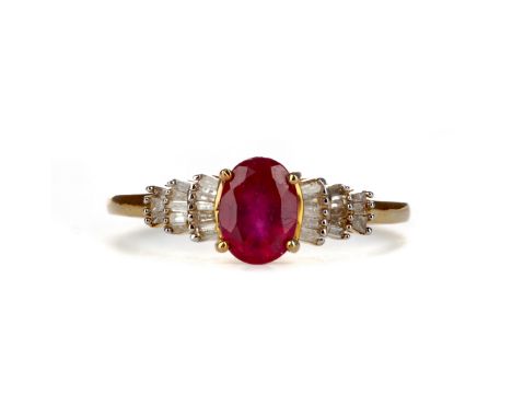 RUBY AND DIAMOND RING, set with an oval ruby on tiered baguette cut diamond shoulders, marked 9K, size P, 2g
