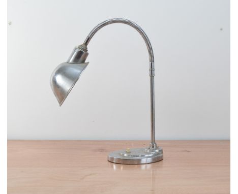 A mid 20th century metal adjustable desk lamp, 80cm high when fully vertical, no wire present and pitting to parts of the ext