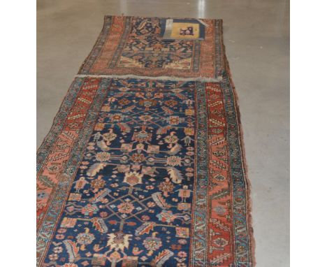 A caucasian runner, retailed by Harvey Nichols, one patch restored, 545cm long 102cm wide