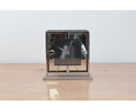 A metal art deco style mantle clock, 19cm x 19cm, some hour markers unattached but present, AF