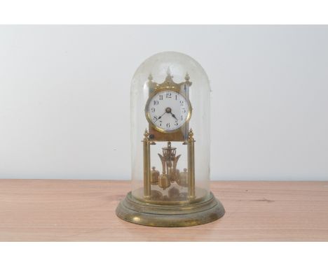 A 20th century anniversary clock,  in a dome, enamel dial, winder present, 29cm high
