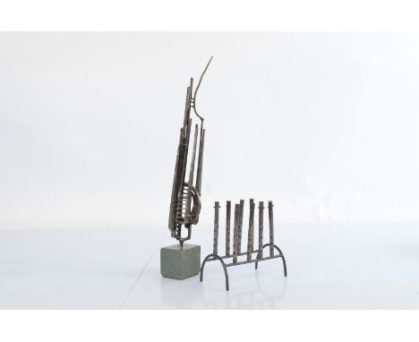 A late 20th century steel and hardstone sculpture, 33 cm high, together with a metal six light table candlestick (2)