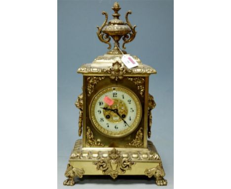 A circa 1900 brass cased mantel clock having a French 8-day striking cylinder movement