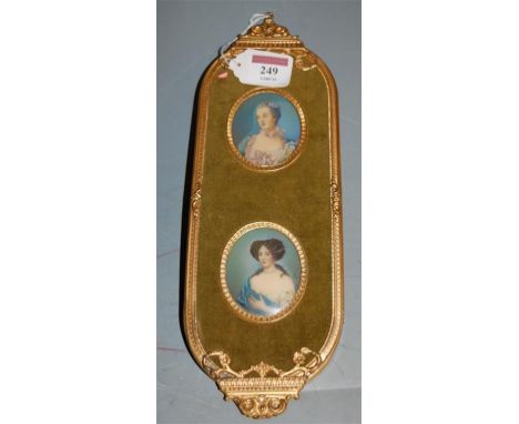 A pair of early 20th century three quarter length portrait miniatures of ladies, each mounted in a singular gilt metal velvet