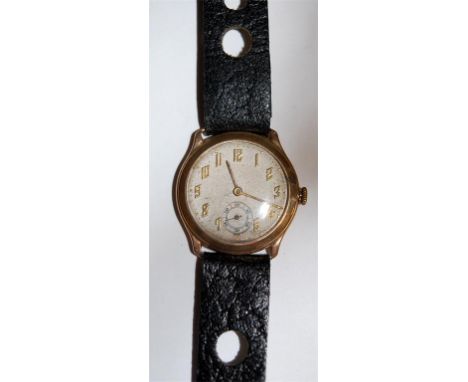 A yellow metal cased gents wristwatch, having silvered dial, subsidiary seconds dial, and manual wind movement 