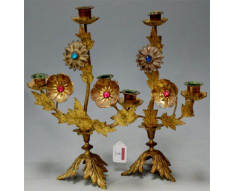 A pair of gilt metal and paste set three light candelabra